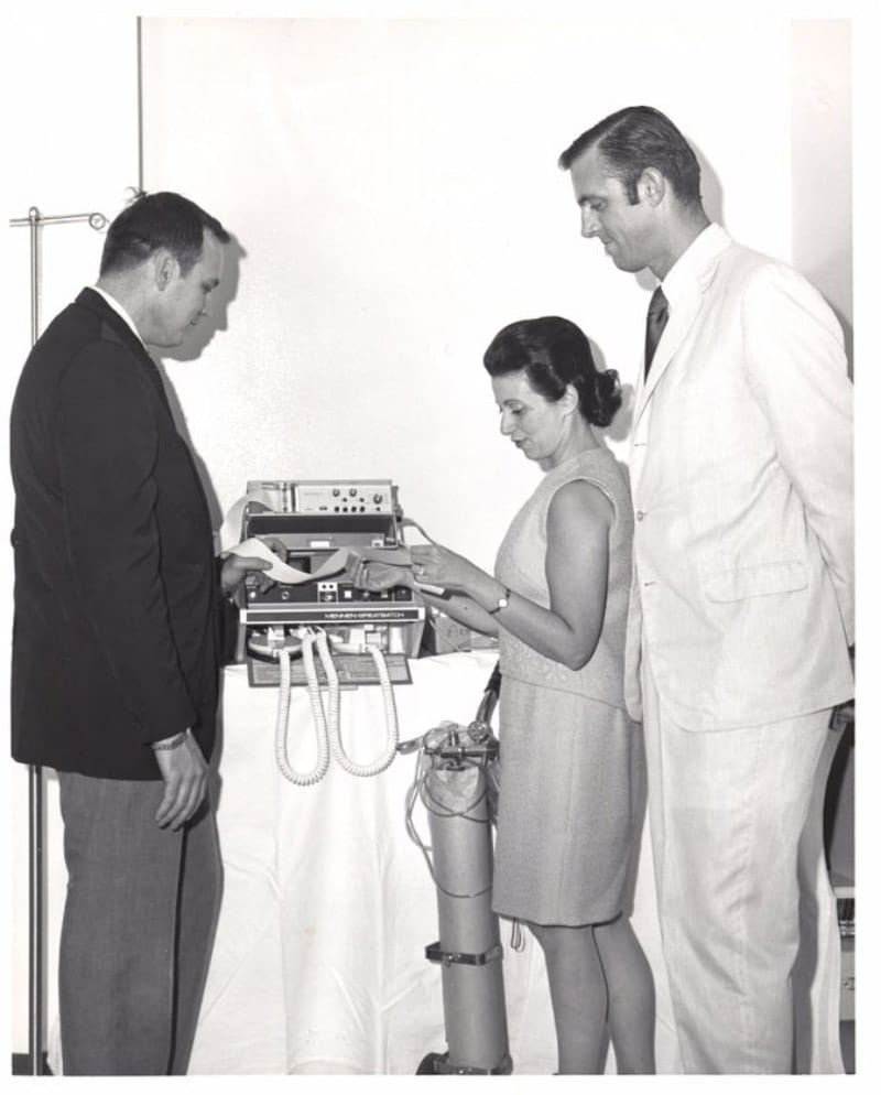 Dr. Nanette Wenger in the 1960s checking research data with her trainees, Dr. William Walters (left) and Dr. Charles Harrison. (Emory Medicine Magazine, Fall 2008)