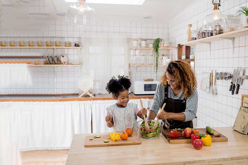 Mom and young daughter cooking Mom and young daughter cooking