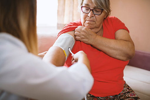 Woman having BP taken