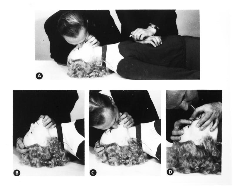 Asmund Laerdal demonstrates CPR on the original Resusci Anne manikin. (American Heart Association archives)