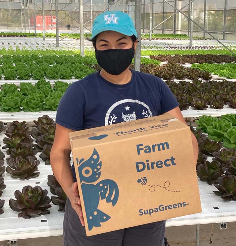 Moonflower Farms' Natalia Chacon gets a farm direct Supagreens box ready for delivery. The boxes provide highly nutritious, hydroponically grown produce at a discount. (Photo courtesy of Moonflower Farms)