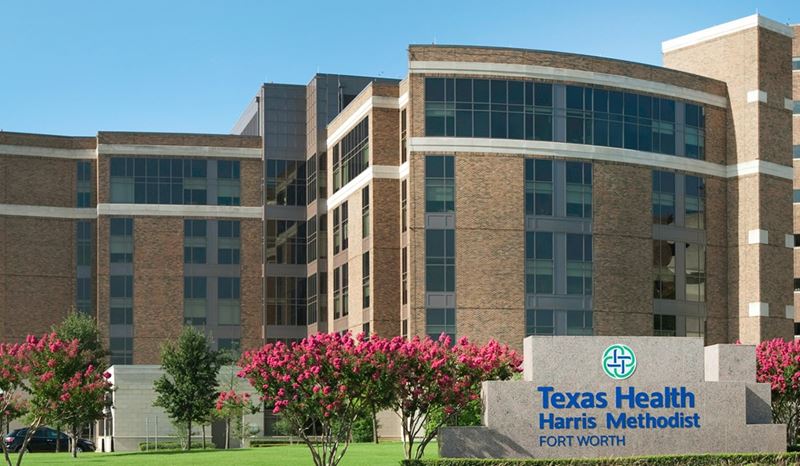 Texas Health Harris Methodist Hospital Fort Worth, top, and doctors at work in its heart catheterization lab, where Kyle Riggs was treated.