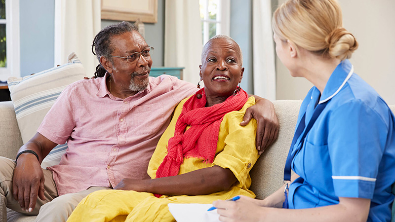 nurse talking to a couple