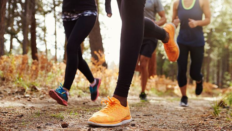 Groups of adults running outdoors