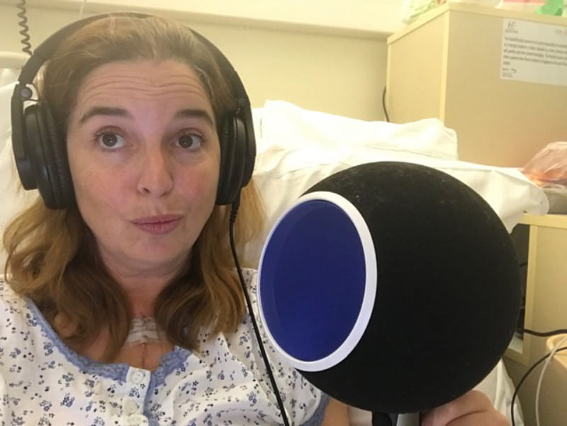 Shana Pennington-Baird recovering from heart surgery – and working – in her hospital bed in Cork, Ireland. (Photo courtesy of Ben Baird)