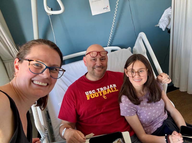 Tony Gnau (center) with Katie and Betsy in the Netherlands hospital where he had the cardiac catheterization procedure. (Photo courtesy of the Gnau family)