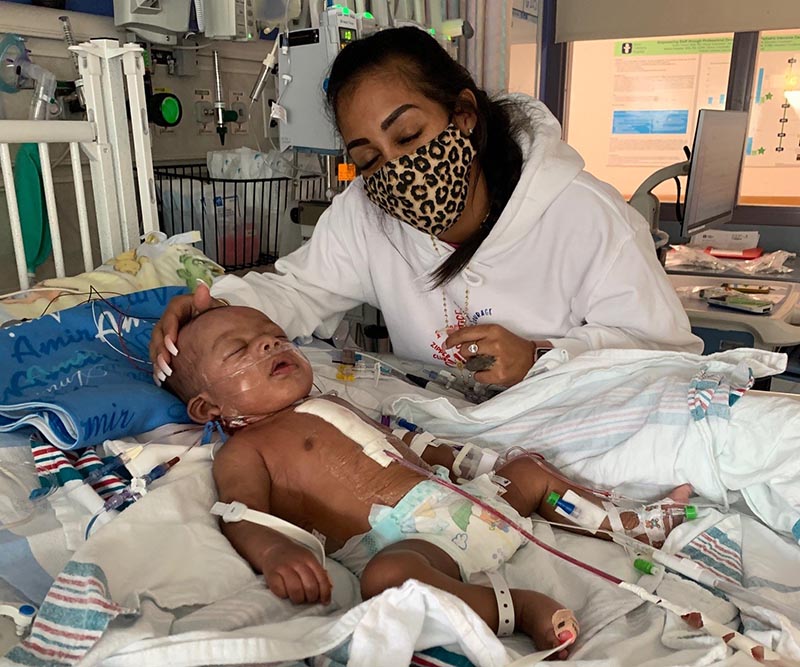 Amir Snell is comforted by his mom, Samantha, after heart surgery. (Photo courtesy of Samantha Snell)