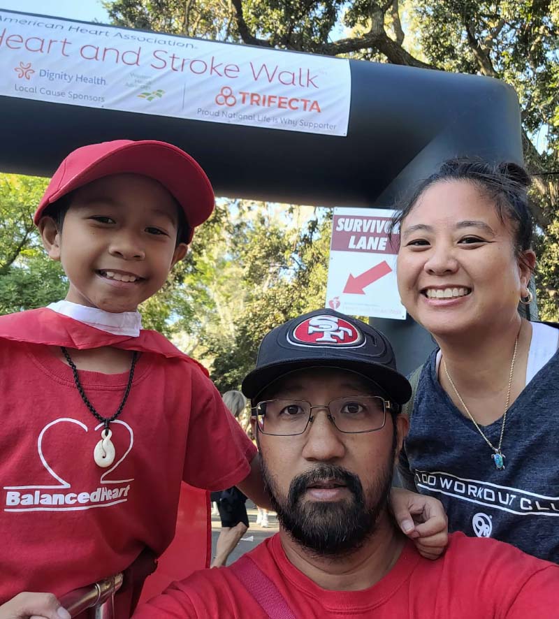 Luke Domingo (left) with his parents, Geody and Mia, at an American Heart Association Heart and Stroke Walk. (Photo courtesy of Mia Domingo)