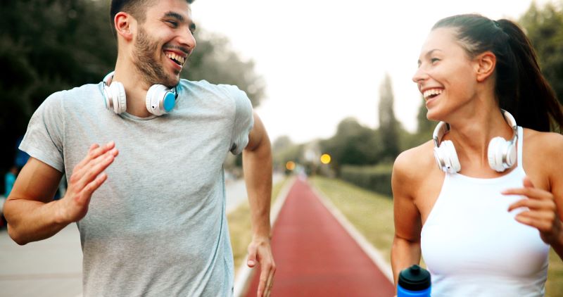 Couple jogging down the road