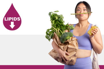 A woman is holding a bag of produce and balancing an asparagus spear on her top lip. A woman is holding a bag of produce and balancing an asparagus spear on her top lip.