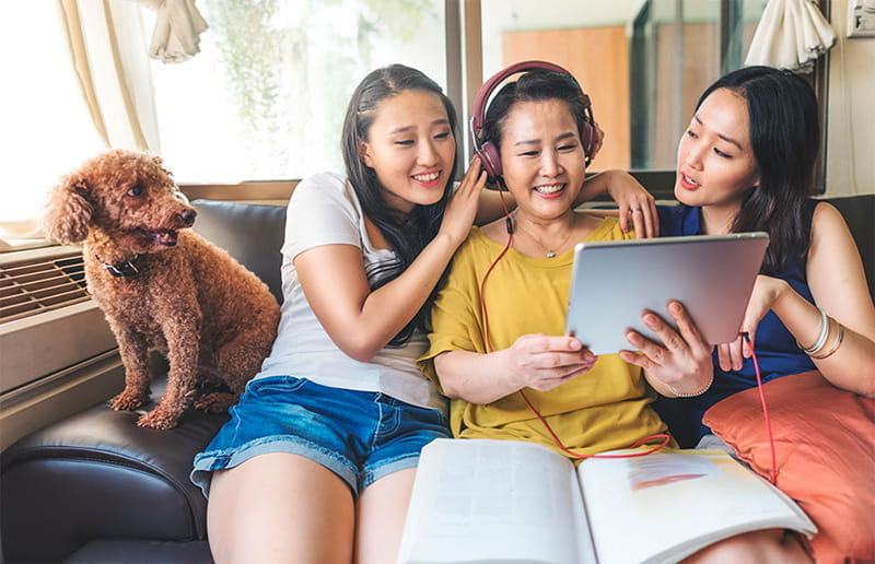 Asian mom sitting with daughters Asian mom sitting with daughters
