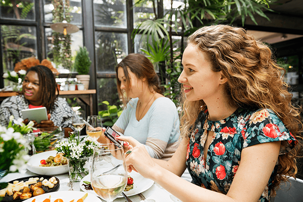 diverse group of women eating together
