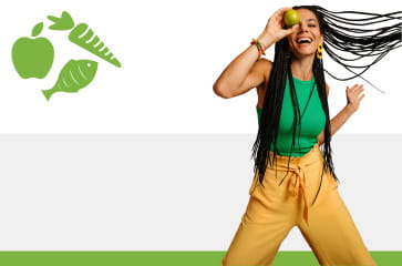 Cheerful woman holding an apple