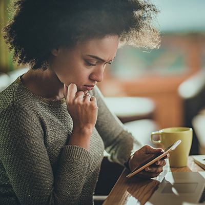 young woman on phone researching or thinking young woman on phone researching or thinking