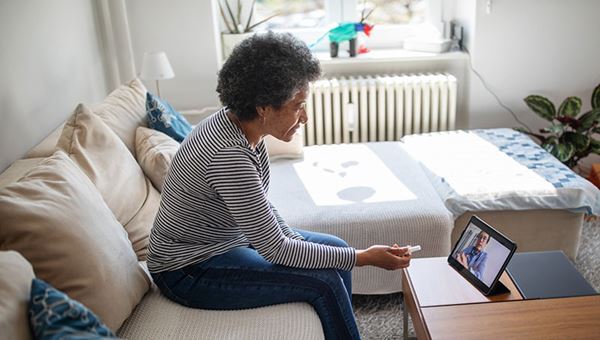 middle aged woman patient consults with doctor on laptop - telemedicine middle aged woman patient consults with doctor on laptop - telemedicine
