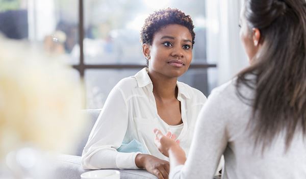 young woman listening to friend young woman listening to friend