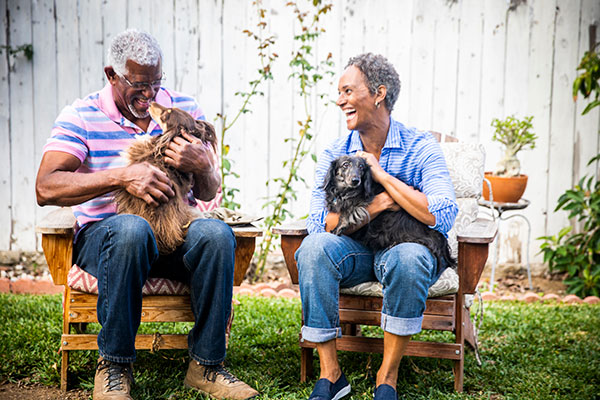 happy middle-aged couple with dogs happy middle-aged couple with dogs