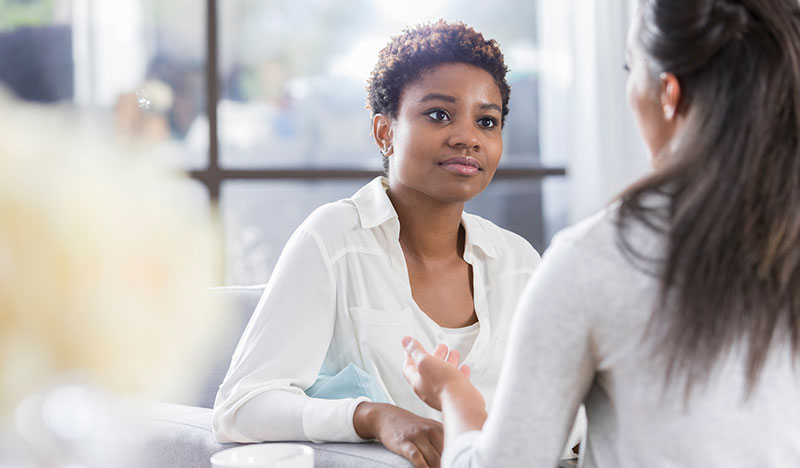young woman listening to friend young woman listening to friend